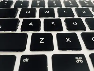 Close view of black keyboard keys with white letters